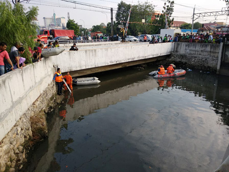 Pencarian Buaya di Kali Grogol Dihentikan Sementara