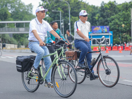 Pj Gubernur Heru Kampanyekan Pola Hidup Sehat sambil Bersepeda di CFD